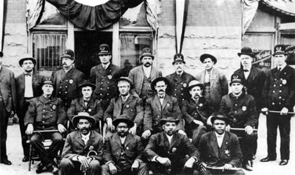 Muskogee Oklahoma Policemen with Bass Reeves in front row with cane. Muskogee Oklahoma Policemen with Bass Reeves in front row with cane.