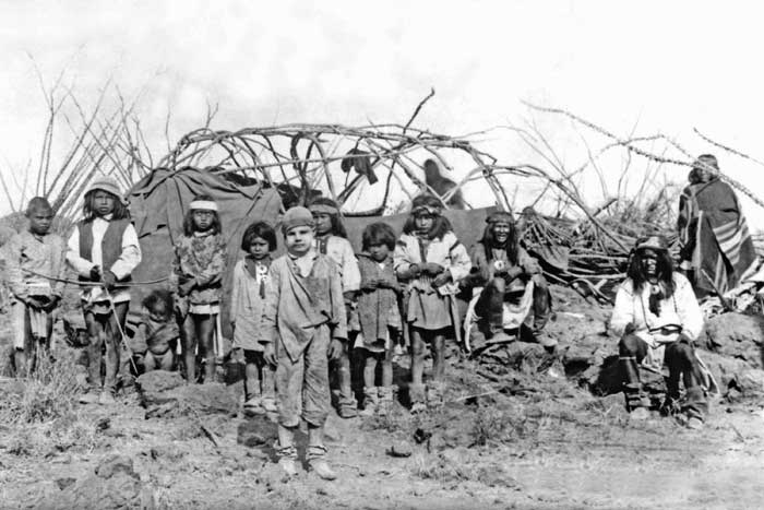 March 1886, Jimmy McKinn (standing center) found with Apache's after Geronimo Surrender. 
