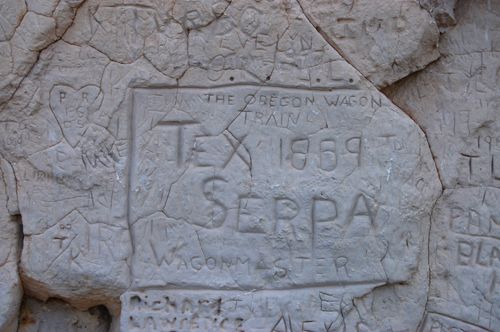 Inscription at Register Cliff indicates that an Oregon bound wagon train, led by Tex Serpa, passed by here by Kathy Alexander. Register Cliff - Serpa
