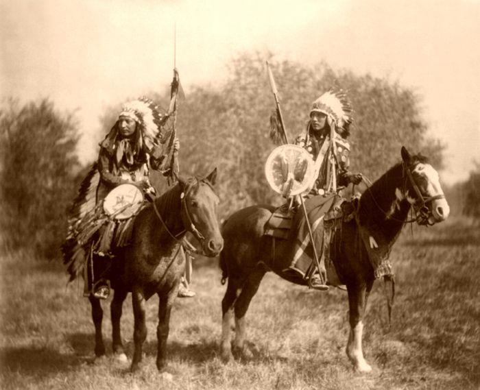 Ogalala Sioux at an oasis in the Badlands, photo by Edward S. Curtis, 1905. Sioux Indians on Horseback, by Heyn, 1899