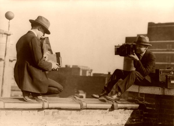 Two photographers taking each others pictures Two photographers early 1900