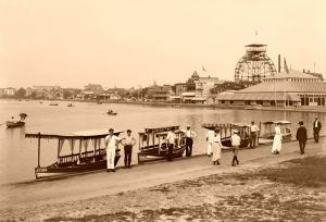 Wesley Lake, Asbury Park, New Jersey. Palace Carousel House and Ferris Wheel upper right. By Detroit Publications, 1901.