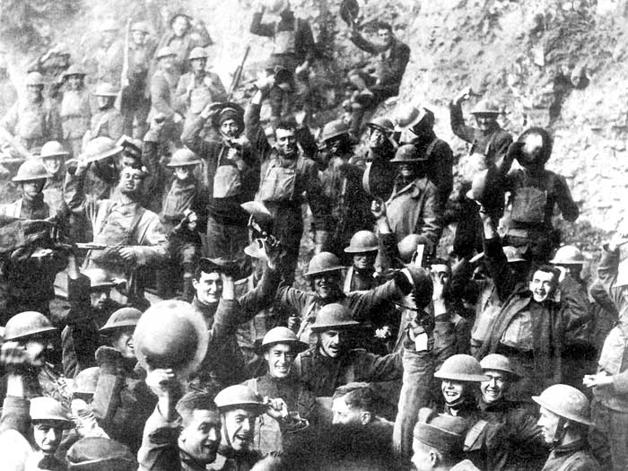 WWI Men of US 64th Regiment, 7th Infantry Division, celebrate the news of the Armistice,11-November 1918.